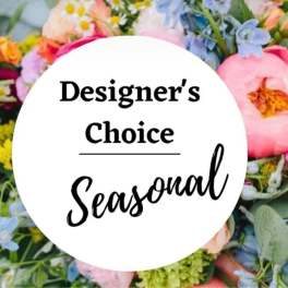 Designer’s choice seasonal flower arrangement with mixed pastel blooms