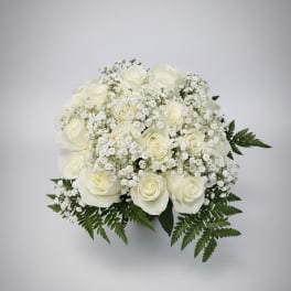 White rose bouquet with baby's breath and fern foliage