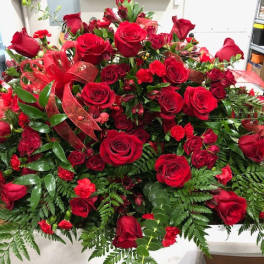 Large bouquet of red roses and carnations with ribbon