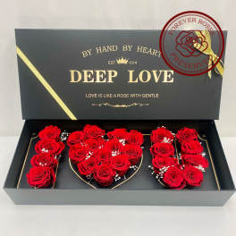 Red roses arranged in a black gift box spelling "DEEP LOVE"