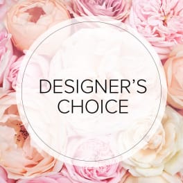 Pink and white roses with a "Designer’s Choice" label