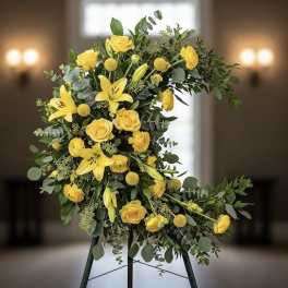 Yellow floral standing spray on an easel