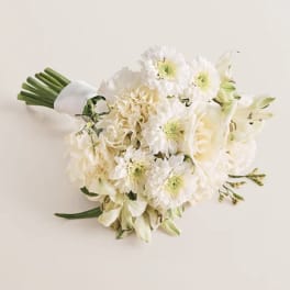 White bouquet with daisies, roses, and lilies tied with a white wrap