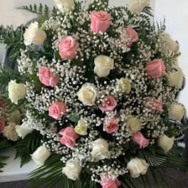 Large bouquet of pink and white roses with baby's breath