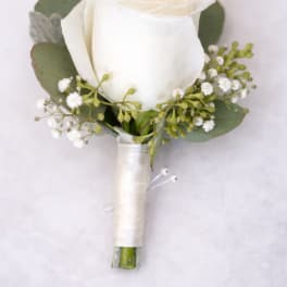 White rose boutonniere with eucalyptus and baby's breath