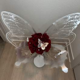 Red rose bouquet with clear butterfly wings and a white butterfly decoration