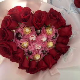 Heart-shaped bouquet of red roses with Ferrero Rocher chocolates