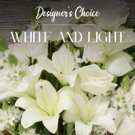 White lilies and small white flowers in a bouquet