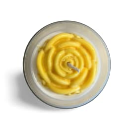 Yellow spiral candle in a glass container