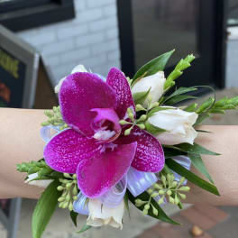 Wrist corsage with purple orchid and white roses