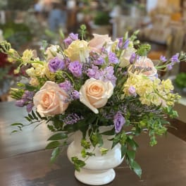 Pastel rose and lavender bouquet in a white vase