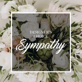 White and pale blush sympathy bouquet with green foliage