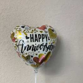 Heart-shaped balloon with "Happy Anniversary" text
