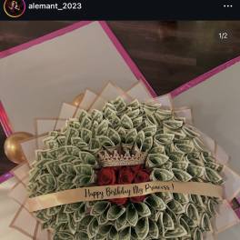 Money bouquet with red roses and a small crown