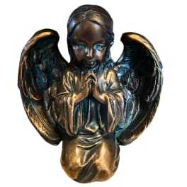 Bronze angel figurine with folded hands and large wings