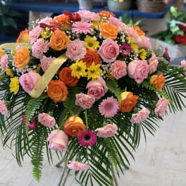 Large mixed bouquet of pink, orange, and yellow flowers