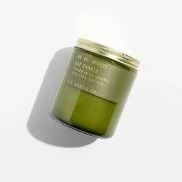 Green soy candle in a glass jar with a metal lid
