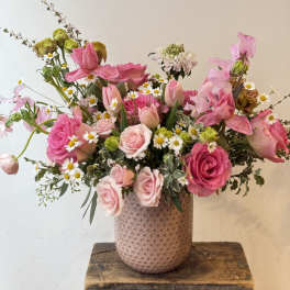 Pink and white mixed bouquet in a textured vase