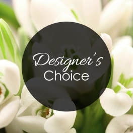 White tulips with a "Designer’s Choice" label