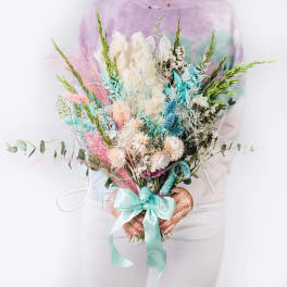 Large pastel bouquet with dried flowers and a satin ribbon