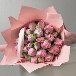 Bouquet of pink peonies wrapped in pink paper