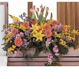 Large mixed floral arrangement with pink tulips and yellow lilies