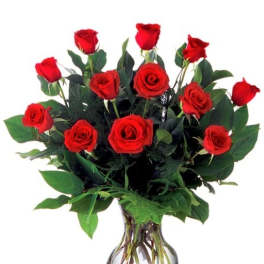 Dozen red roses arranged in a rounded clear glass vase