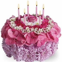 Pink floral cake arrangement with candles and a rose center
