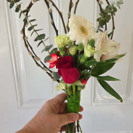 Handheld bouquet with red roses, white gerbera daisies, and alstroemeria