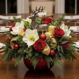 Holiday centerpiece with red roses, white amaryllis, and a deer figurine
