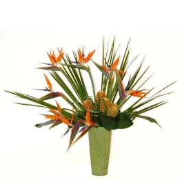 Tall green vase with orange tropical flowers and palm fronds in a fan-like arrangement