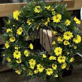 Yellow daisy wreath on a standing easel