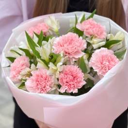Pink carnations and white alstroemeria in pink wrapping