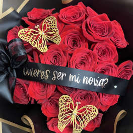 Red rose bouquet with black ribbon and gold butterfly decorations