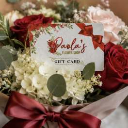 Bouquet of red and blush roses with white flowers and a gift card
