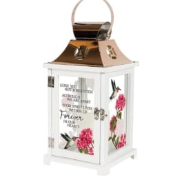White memorial lantern with pink floral panels and a hummingbird design