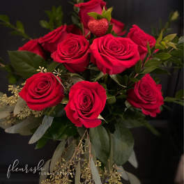 Bouquet of red roses with a glittery heart pick