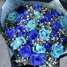 Bouquet of blue and purple roses with white baby's breath