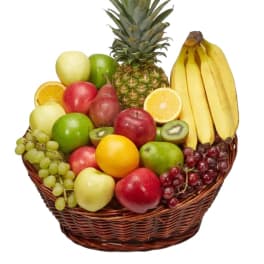 Fruit basket with pineapple, bananas, apples, grapes, kiwi, and citrus