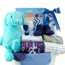 Blue baby gift basket with a plush bunny and folded clothes