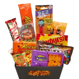 Halloween candy assortment in a black gift basket
