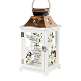 White lantern with floral panels and a memorial quote