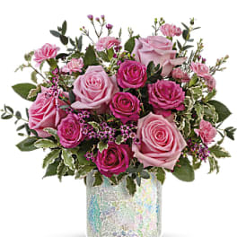 Pink roses and carnations in a mosaic glass vase
