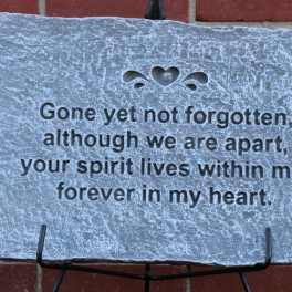 Memorial stone plaque with an engraved sympathy message