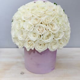 White rose bouquet in a lavender hatbox
