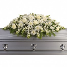 White floral casket spray with chrysanthemums and lilies