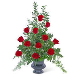 Tall arrangement of red roses in a gray vase