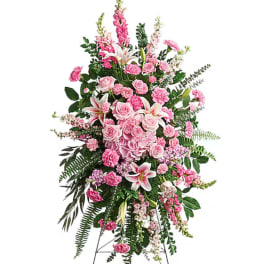 Tall pink and white floral standing spray on an easel