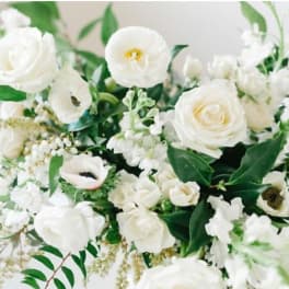 White floral bouquet with roses and mixed blooms