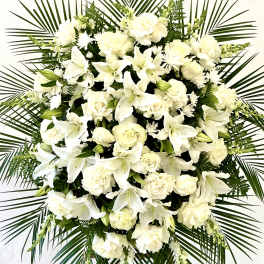 White floral standing spray with roses and lilies